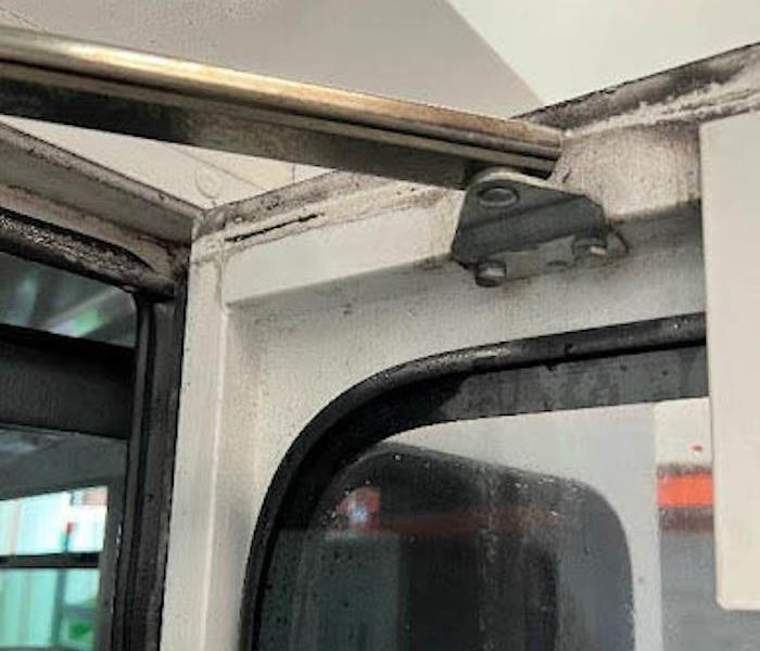 Bus door hinge covered in mold. 